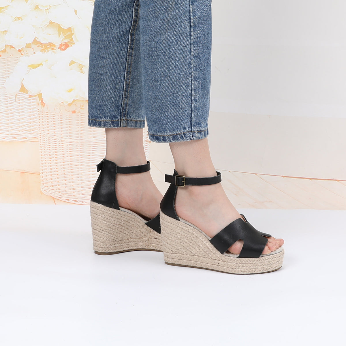 TONIVIS black leather platform wedge sandals on model side