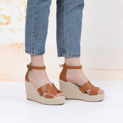 TONIVIS cognac leather platform wedge sandals on model