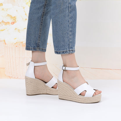 TONIVIS white leather platform wedge sandals on model side