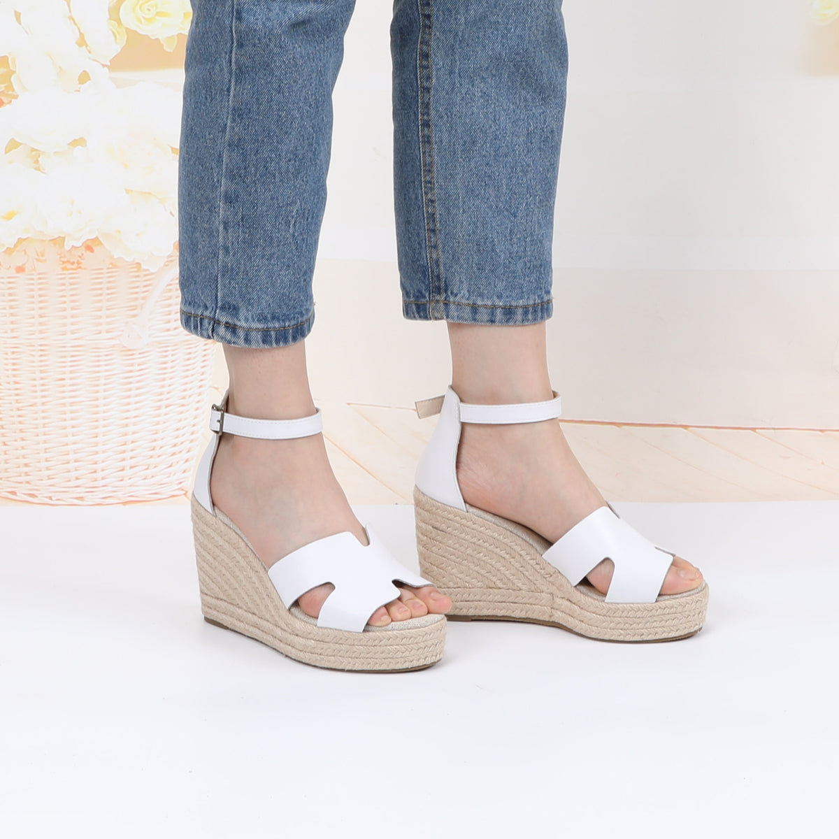 TONIVIS white leather platform wedge sandals on model
