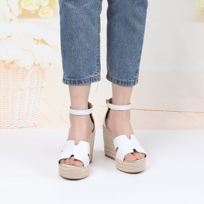 TONIVIS white leather platform wedge sandals on model front